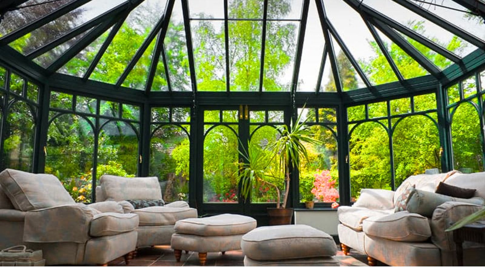 A bright sunroom with a large glass roof, perfect for creating a greenhouse environment in your home.